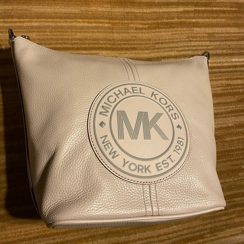 Michael Kors Fulton Sport bucket bag in pearl gray.